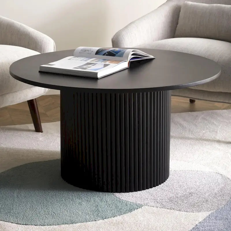Table basse ronde à piètement cannelé