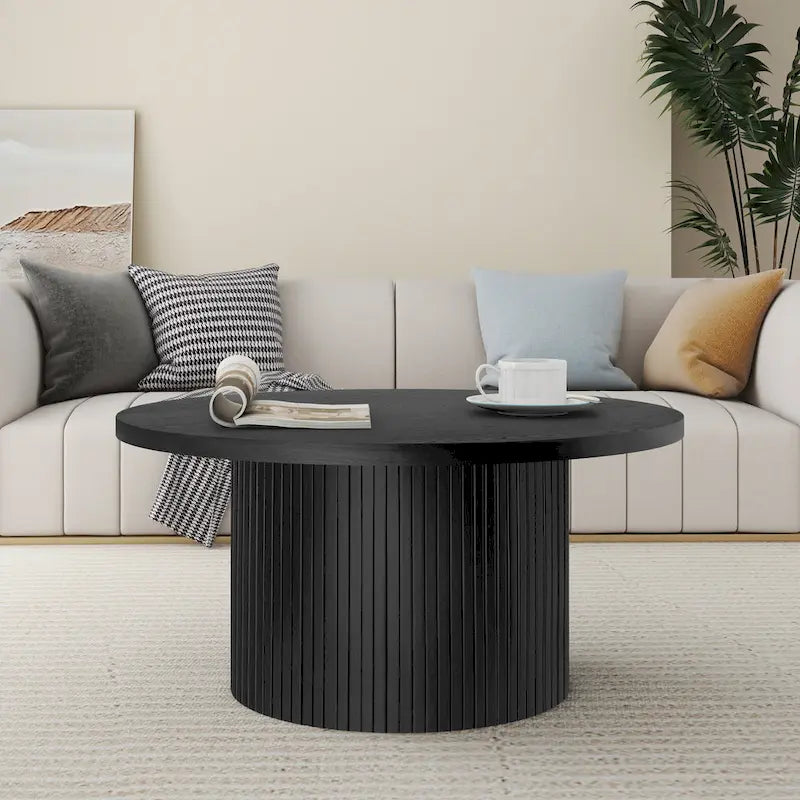 Table basse ronde à piètement cannelé