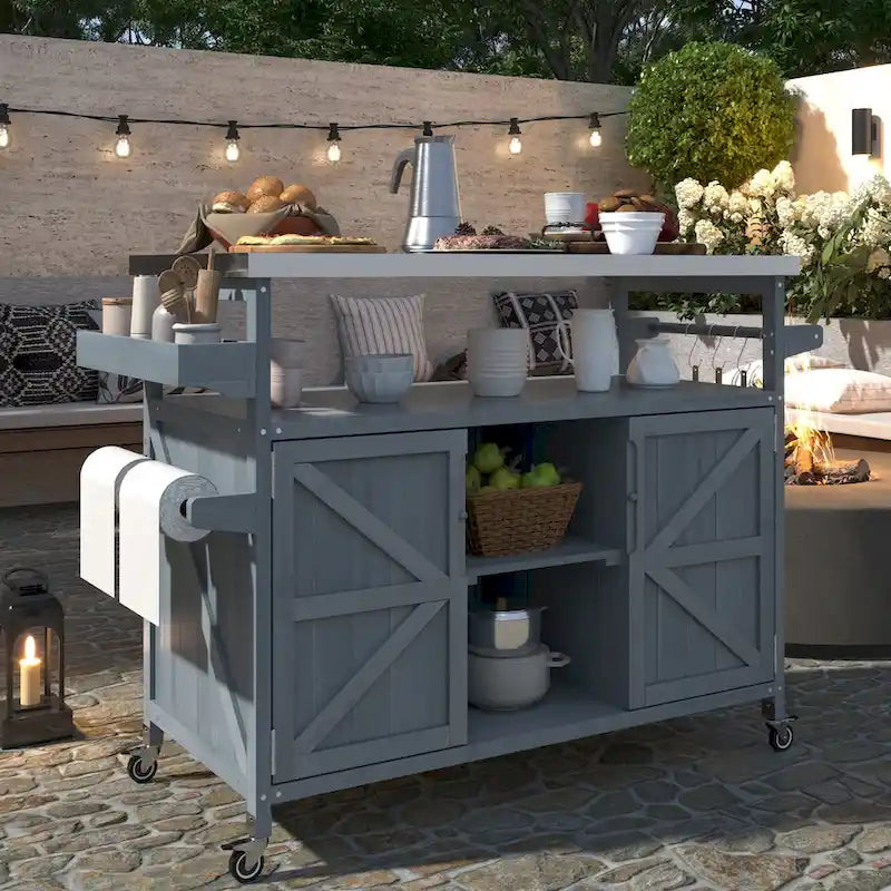 Îlot de cuisine d’extérieur avec chariot à roulettes et plateau en acier inoxydable
